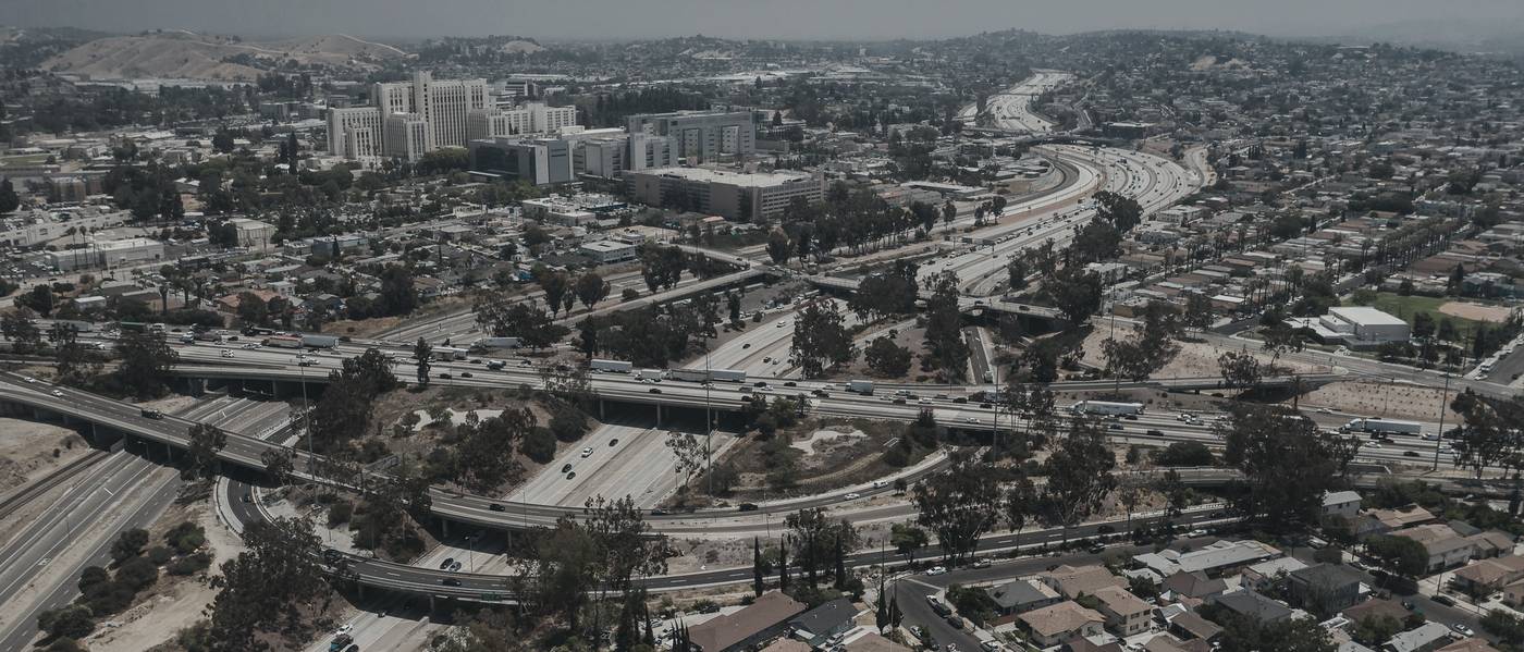 Aerial view of a city with freeway interchange